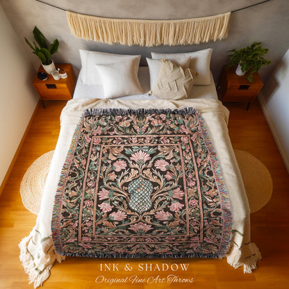 May include: A floral throw blanket with a black background and pink, green, and blue accents is displayed on a bed. The blanket has a fringed edge and the text "INK & SHADOW Original Fine Art Throws" is visible.