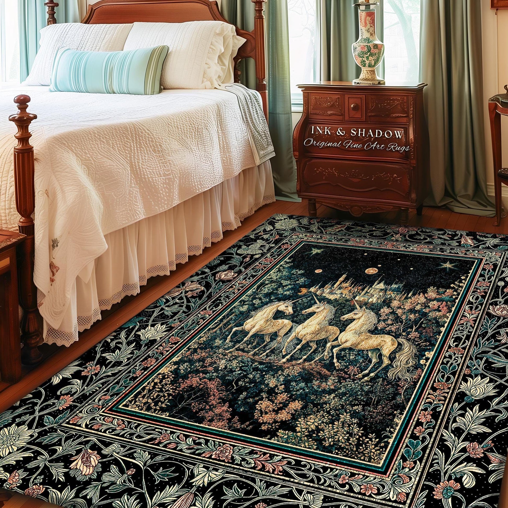 May include: A rectangular area rug with a dark background and a central image of three unicorns in a forest. The rug has a floral border with the text "INK & SHADOW Original Fine Art Rugs".