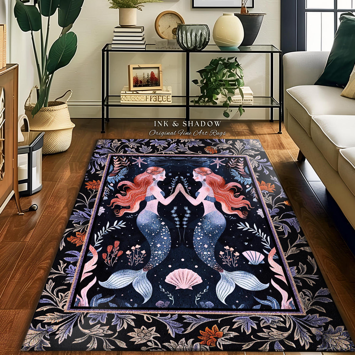 May include: Rectangular area rug featuring two mermaids with red hair and blue tails, facing each other. The rug has a dark background with floral and seashell motifs, and the text "INK & SHADOW Original Fine Art Rugs".