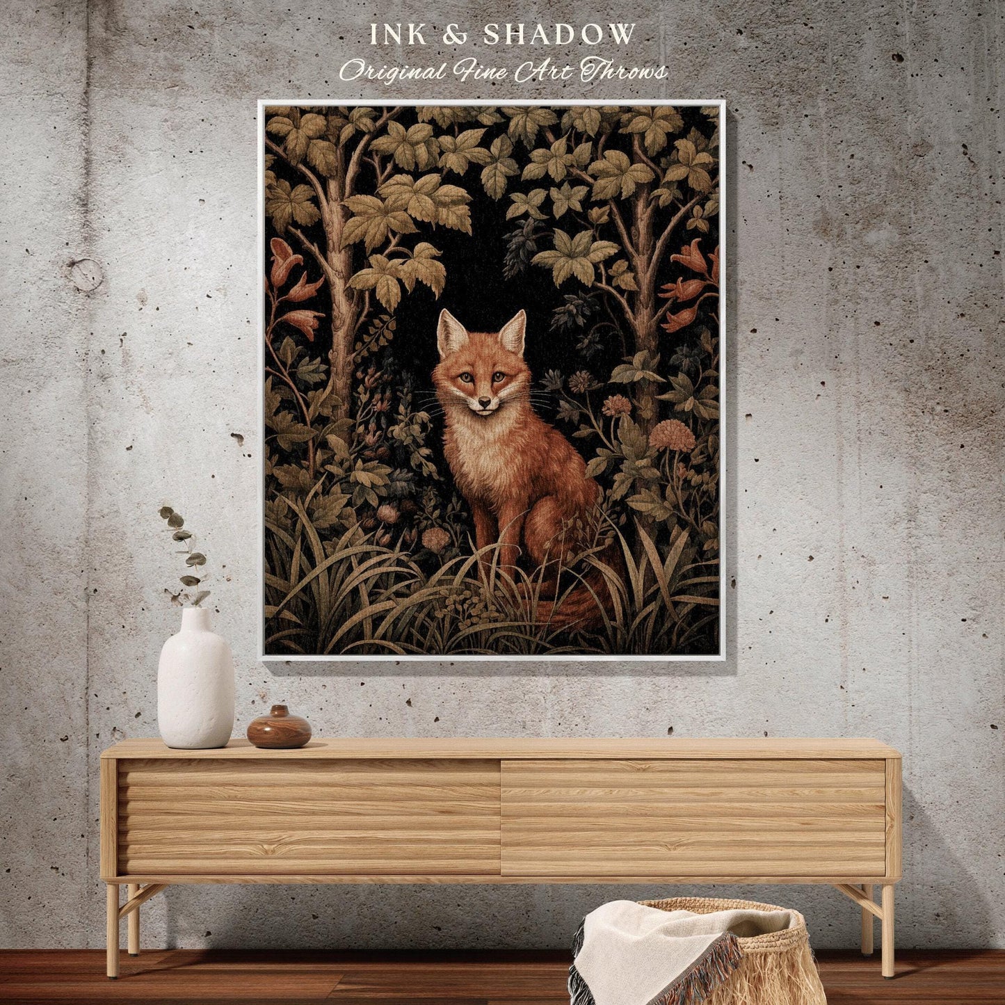 May include: A framed art print featuring a fox in a forest setting. The artwork has a vintage aesthetic with a color palette of browns, greens, and black. The text "INK & SHADOW Original Fine Art Throws" is at the top.