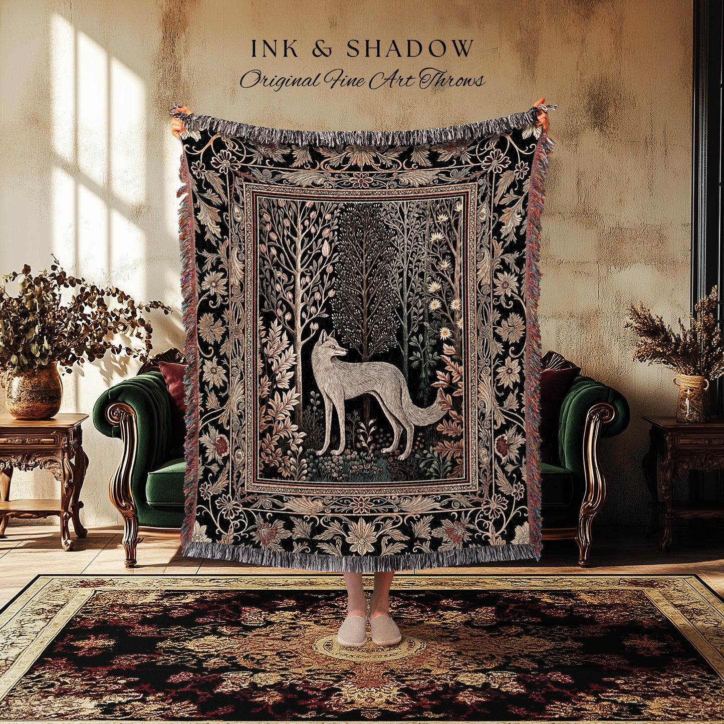 May include: A black throw blanket with a detailed forest and fox design. The blanket has a fringed edge and the text "INK & SHADOW Original Fine Art Throws" at the top. The blanket is displayed in a room with a green sofa and a patterned rug.