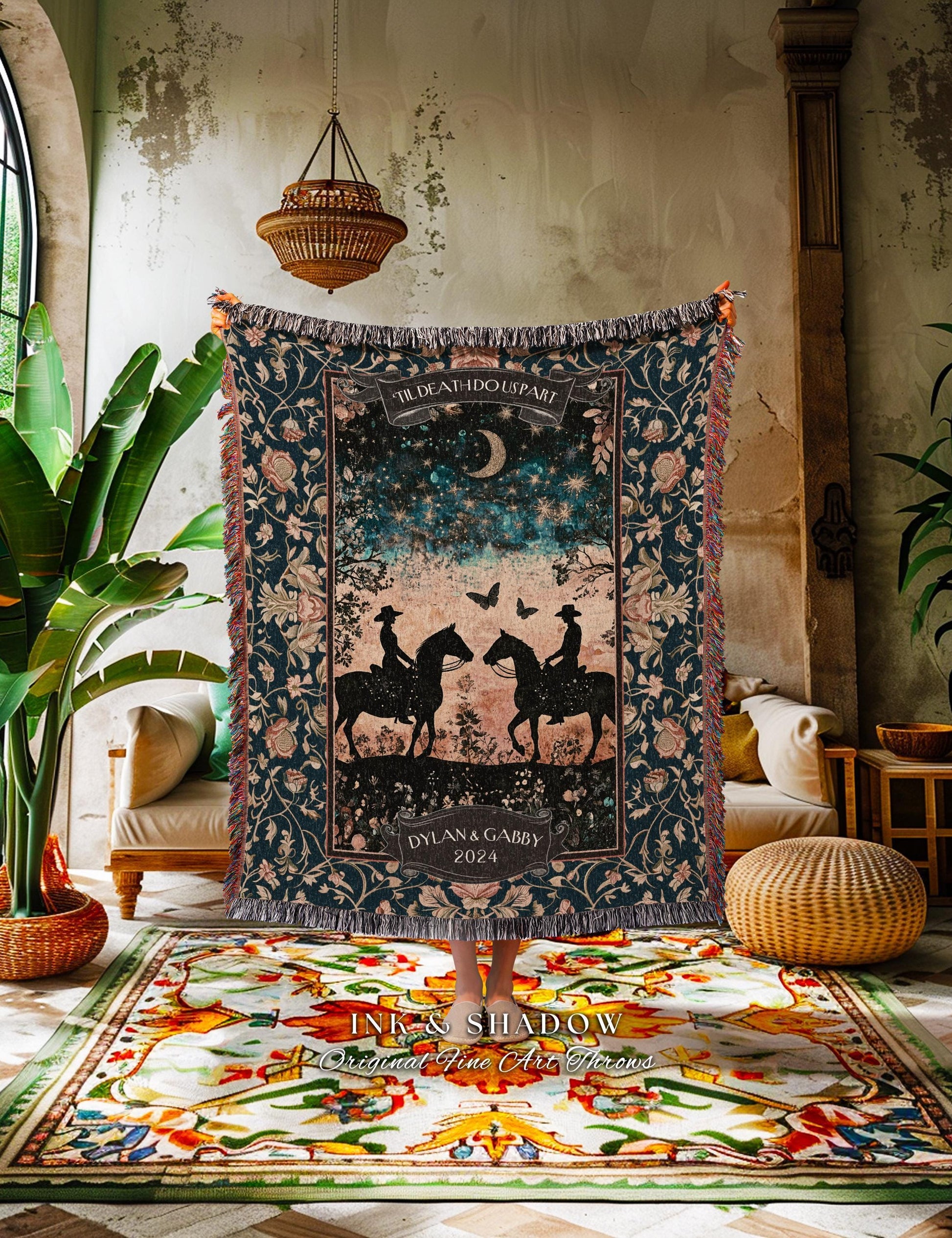 May include: A dark blue woven throw blanket with a floral pattern and fringed edges. The center features a design of two riders on horseback under a starry sky, with the text "TIL DEATH DO US PART" and "DYLAN & GABBY 2024".