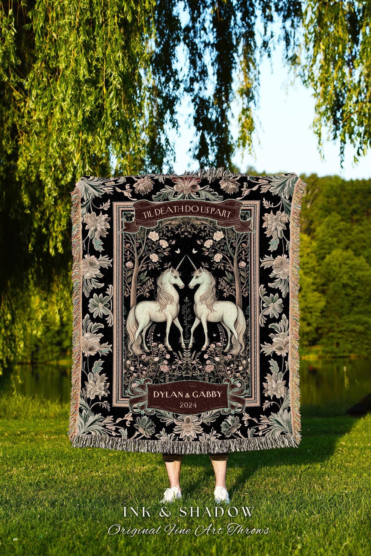 May include: Black throw blanket featuring two white unicorns facing each other, framed by floral and tree designs. The text "TIL DEATH DO US PART" is at the top, with "DYLAN & GABBY 2024" below. The blanket has a fringed edge.