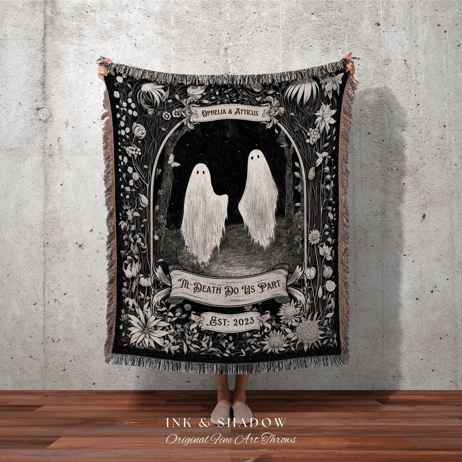 May include: Black and white throw blanket featuring a gothic illustration of two ghosts in a forest scene. The blanket includes the text "Ophelia & Atticus", "Til Death Do Us Part", and "Est: 2023". The blanket has a fringed edge.