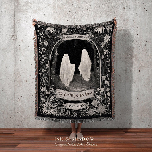 May include: Black and white throw blanket featuring a gothic illustration of two ghosts in a forest scene. The blanket includes the text "Ophelia & Atticus", "Til Death Do Us Part", and "Est: 2023". The blanket has a fringed edge.