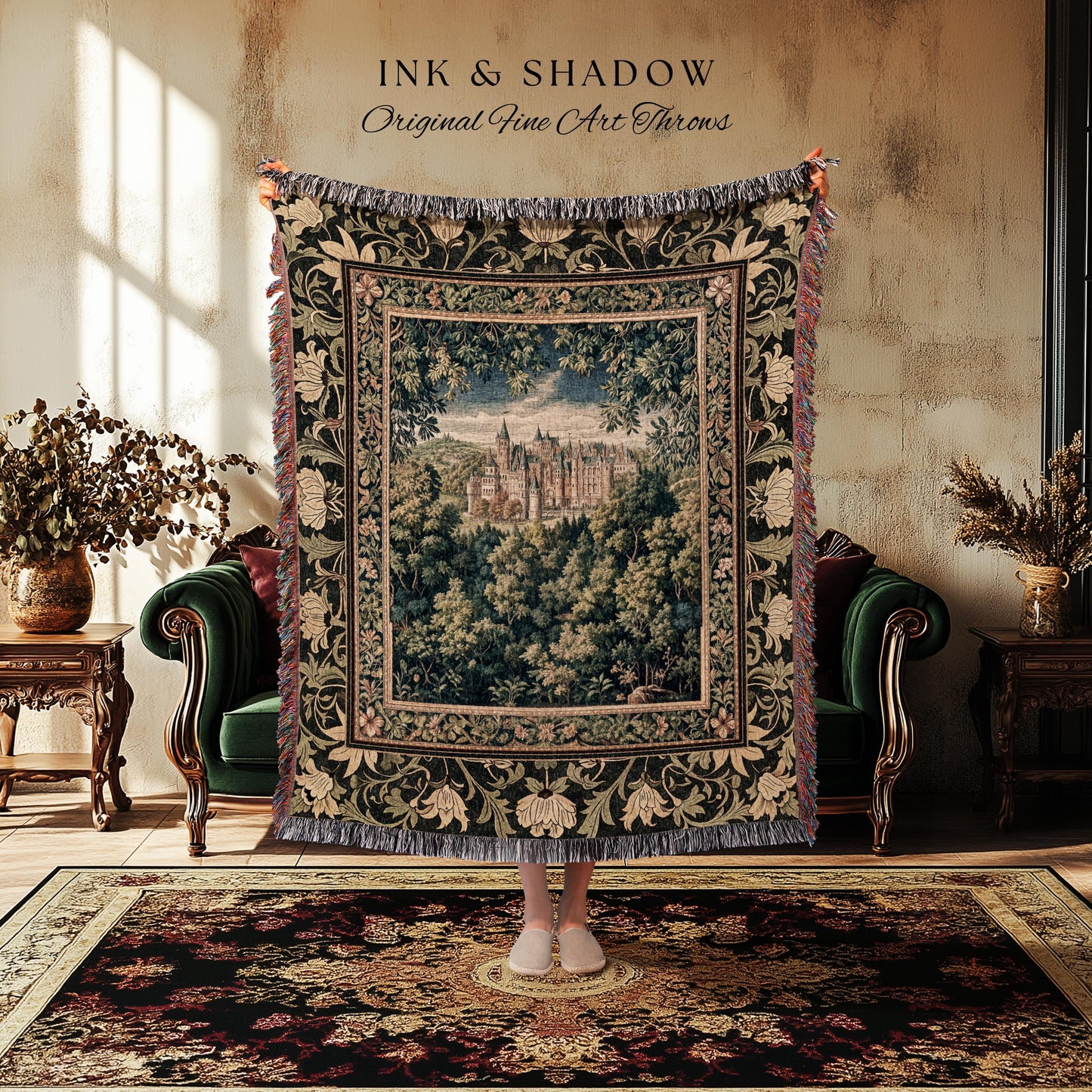 May include: A tapestry throw blanket with a castle scene framed by a floral border. The throw is dark green with cream and red accents, and the text "INK & SHADOW Original Fine Art Throws" is at the top.