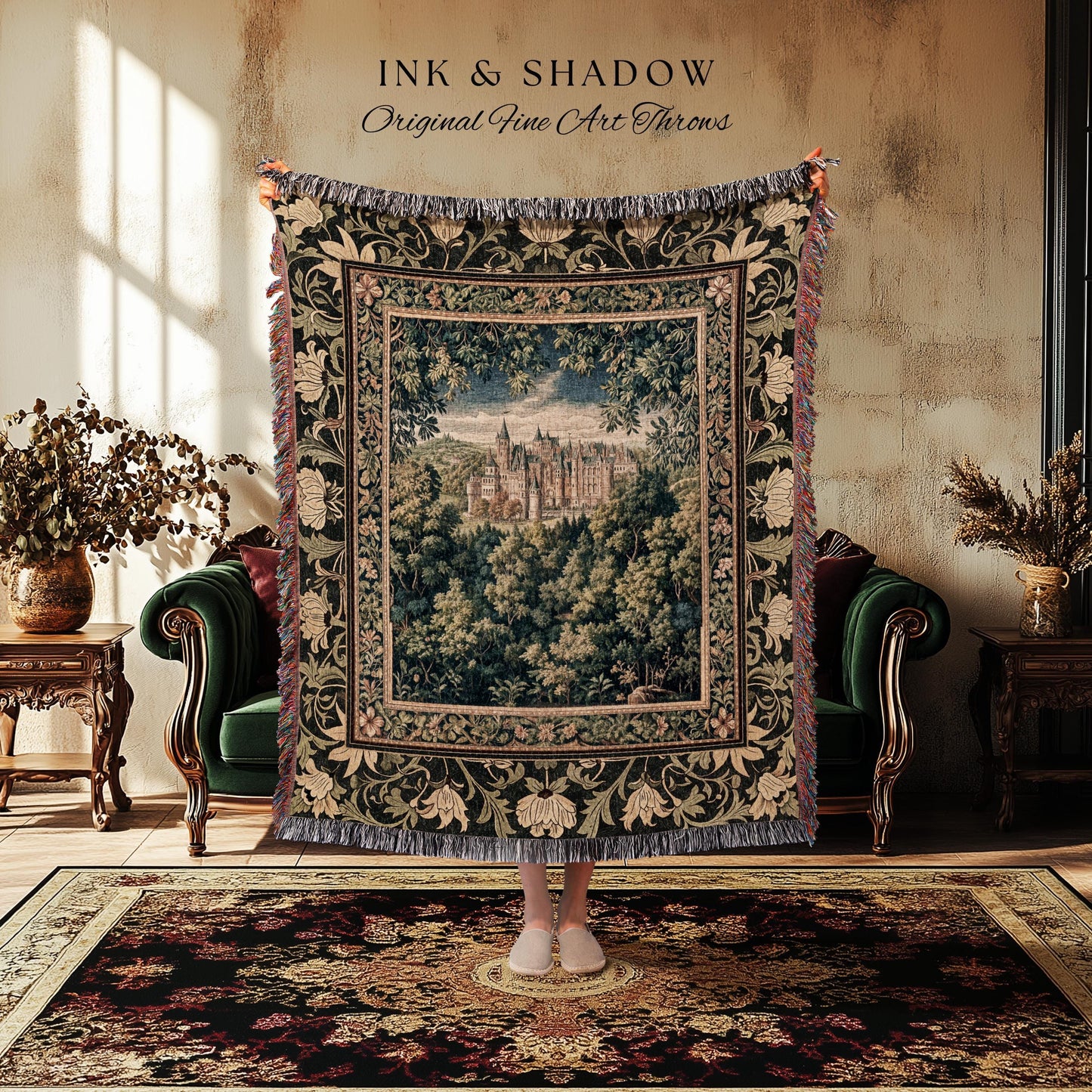 May include: A tapestry throw blanket with a castle scene framed by a floral border. The throw is dark green with cream and red accents, and the text "INK & SHADOW Original Fine Art Throws" is at the top.