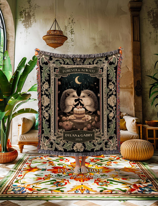 May include: A black throw blanket with a romantic design featuring two hedgehogs, a cake, and the text "Forever & Always" and "Dylan & Gabby 2024". The blanket has a decorative border and fringe.