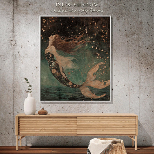 May include: A framed art print featuring a mermaid with flowing red hair and a patterned tail, set against a starry night sky. The artwork is labeled "Ink & Shadow Original Fine Art Throws."