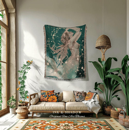 May include: A woven tapestry featuring a mermaid illustration in shades of teal, white, and gold, with the text "INK & SHADOW Original Fine Art Throws". The artwork depicts a mermaid with flowing hair and a shimmering tail, set against a starry background.