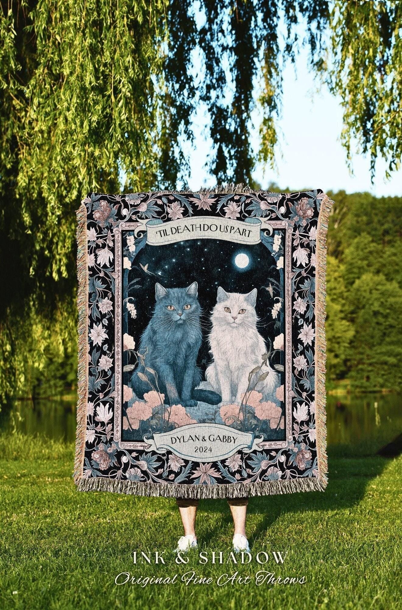 May include: A decorative throw blanket featuring two cats, one blue and one white, under a night sky with a full moon. The text "TIL DEATH DO US PART" and "DYLAN & GABBY 2024" are displayed. The blanket has a floral border and fringe.