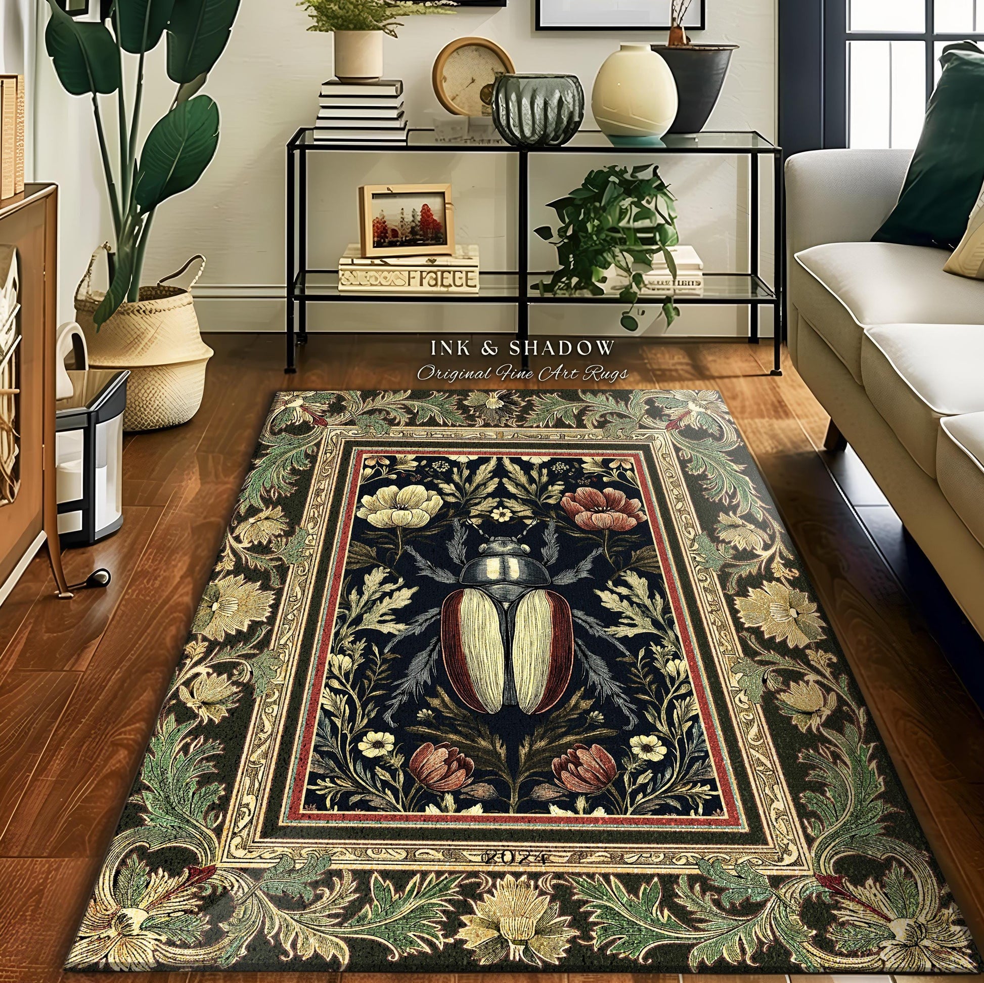 May include: A rectangular area rug with a dark blue background and a central design featuring a large beetle. The rug is framed by a border of floral and leaf patterns in shades of green, gold, and red. The text "INK & SHADOW Original Fine Art Rugs" is visible.