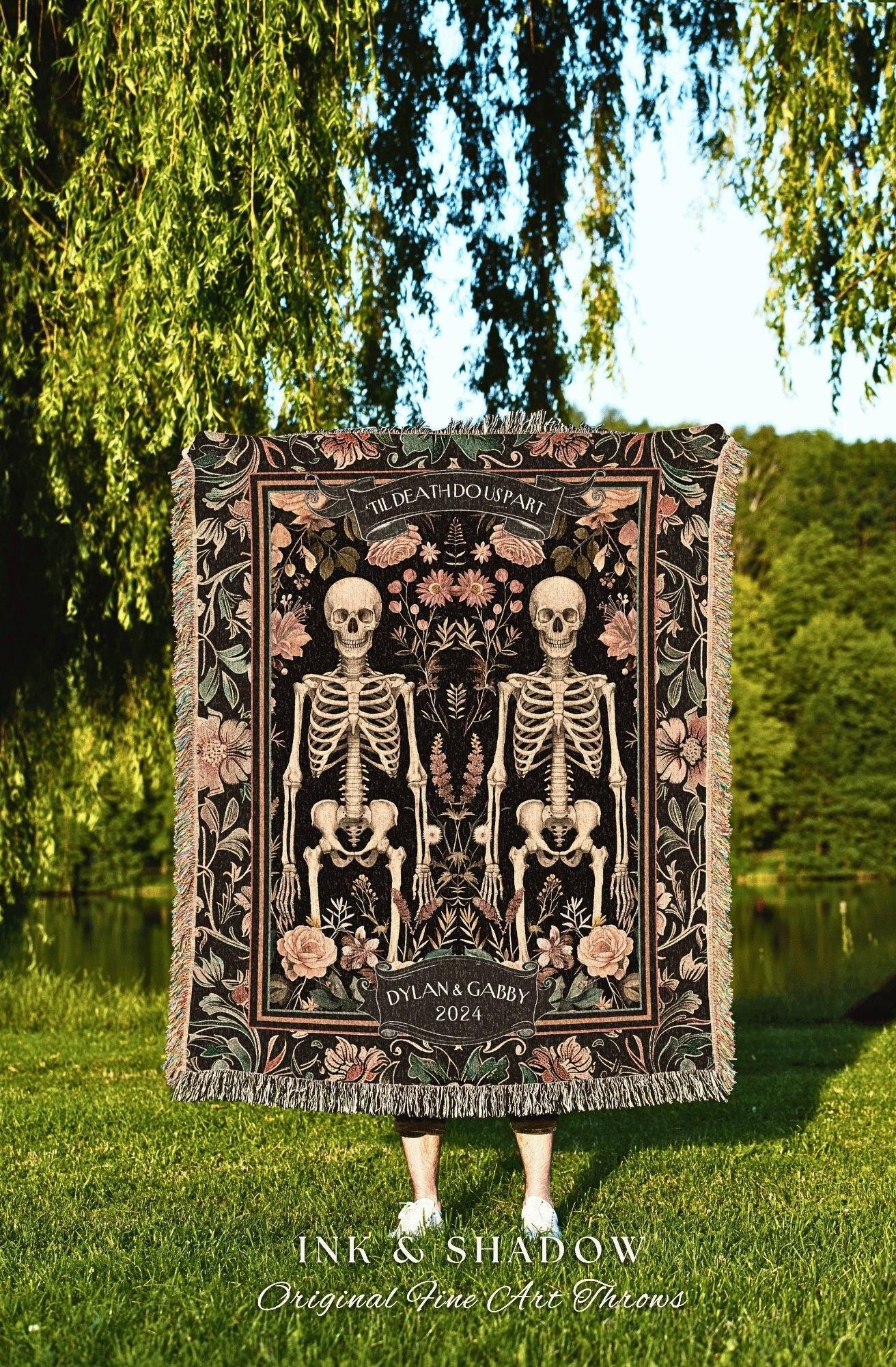 May include: Black throw blanket with a floral and skeleton design. The blanket features two skeletons, the text "TIL DEATH DO US PART", and the names "DYLAN & GABBY 2024". The bottom of the blanket reads "INK & SHADOW Original Fine Art Throws".