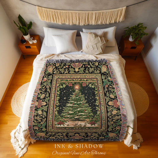 May include: A black Christmas-themed throw blanket with a detailed design featuring a central Christmas tree, surrounded by a border of floral and botanical elements. The blanket has a fringed edge and the text "INK & SHADOW Original Fine Art Throws".