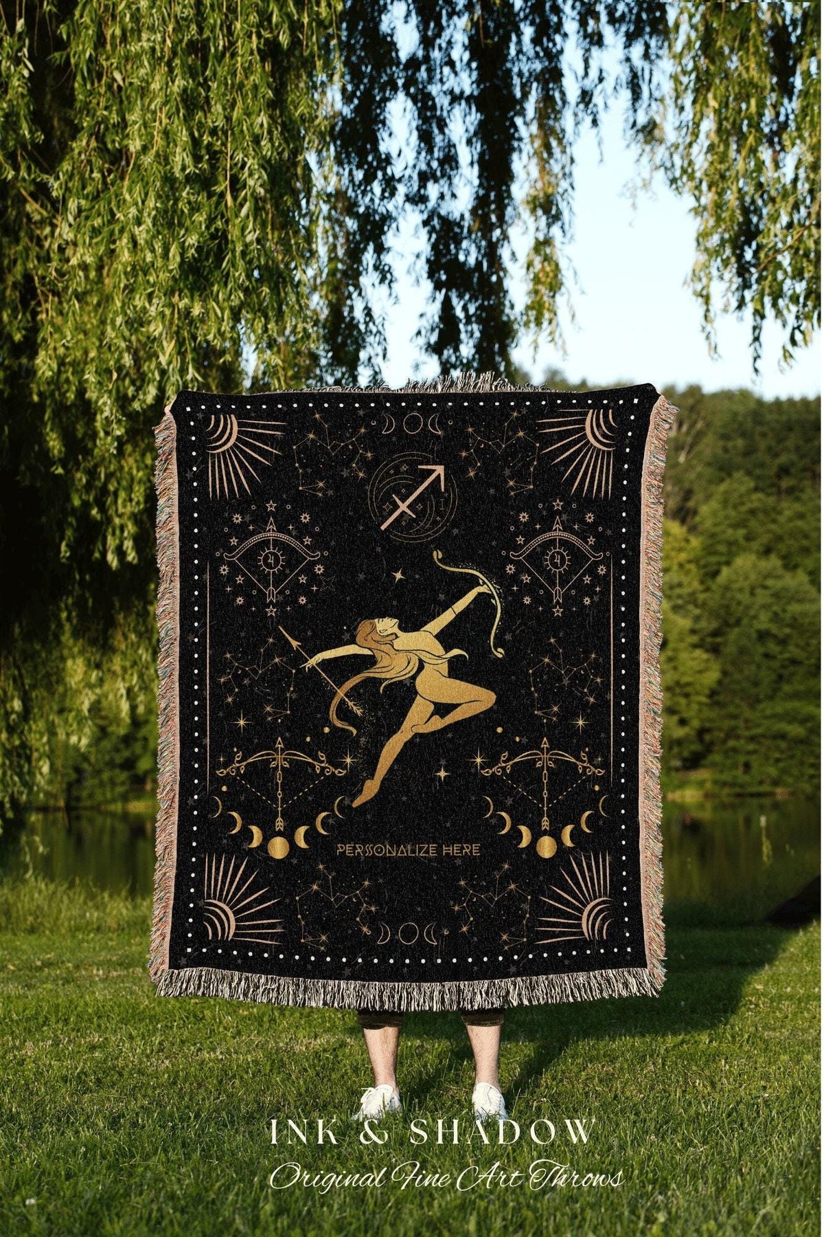 May include: Black throw blanket with a gold Sagittarius design. The blanket features a constellation pattern, a Sagittarius figure, and the text "PERSONALIZE HERE". The bottom of the blanket has a fringe.