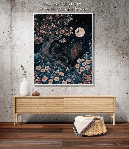 May include: A framed art print featuring a dragon nestled under a tree, with a full moon in the night sky. The artwork is surrounded by flowers and foliage, with the text "INK & SHADOW Original Fine Art Throws" at the top.