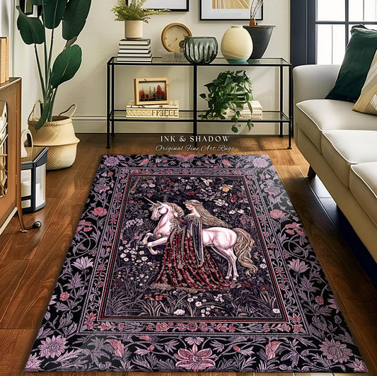 May include: A rectangular area rug featuring a woman and a unicorn in a floral garden design. The rug has a black background with pink and purple floral borders and accents. The text "INK & SHADOW Original Fine Art Rugs" is visible.