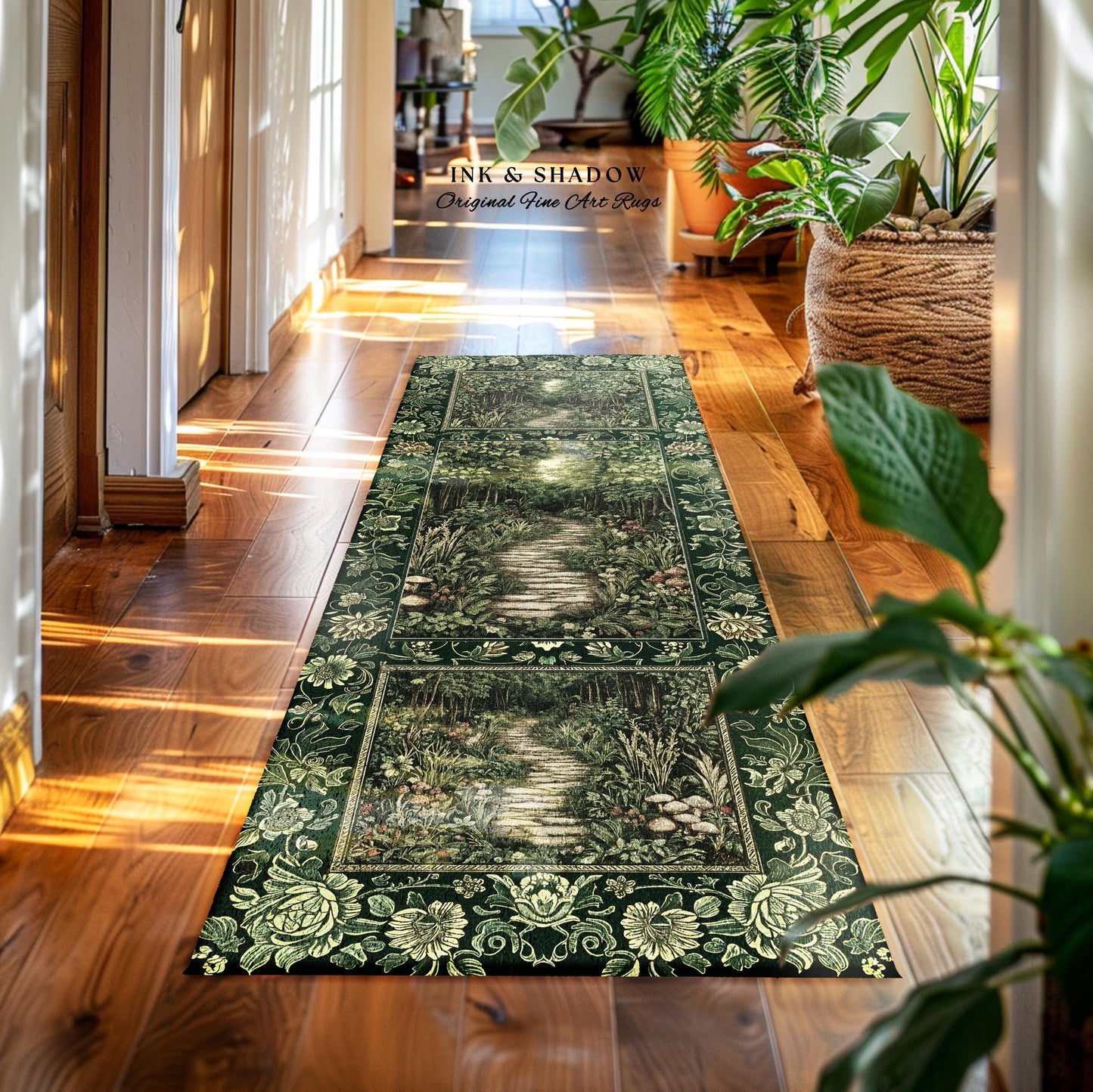 May include: A rectangular green and cream rug with a forest path design. The rug features a detailed illustration of a stone path winding through a lush forest, framed by floral borders. The text "INK & SHADOW Original Fine Art Rugs" is visible.