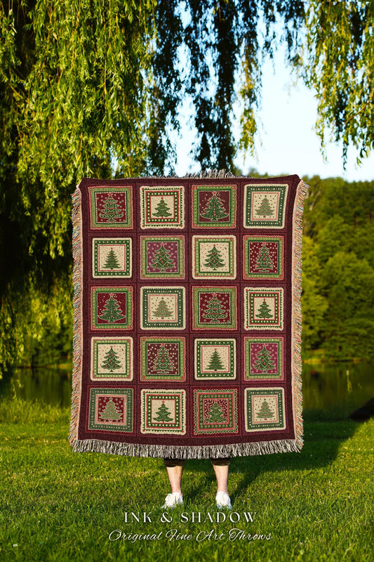 May include: A burgundy throw blanket with a repeating pattern of Christmas trees in squares. The trees are green and red, set against a cream and burgundy background. The blanket has a fringed edge and the text "INK & SHADOW Original Fine Art Throws".