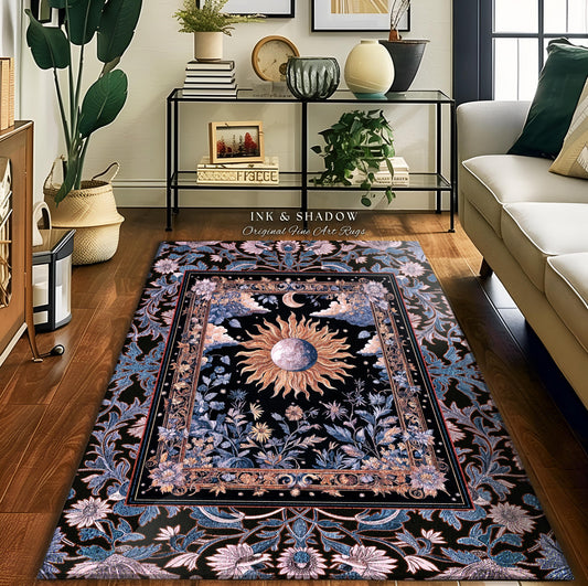 May include: A rectangular area rug with a black background and a central design featuring a sun, moon, and floral elements. The rug has a border with floral and leaf patterns in shades of blue, pink, and gold. The text "INK & SHADOW Original Fine Art Rugs" is visible.