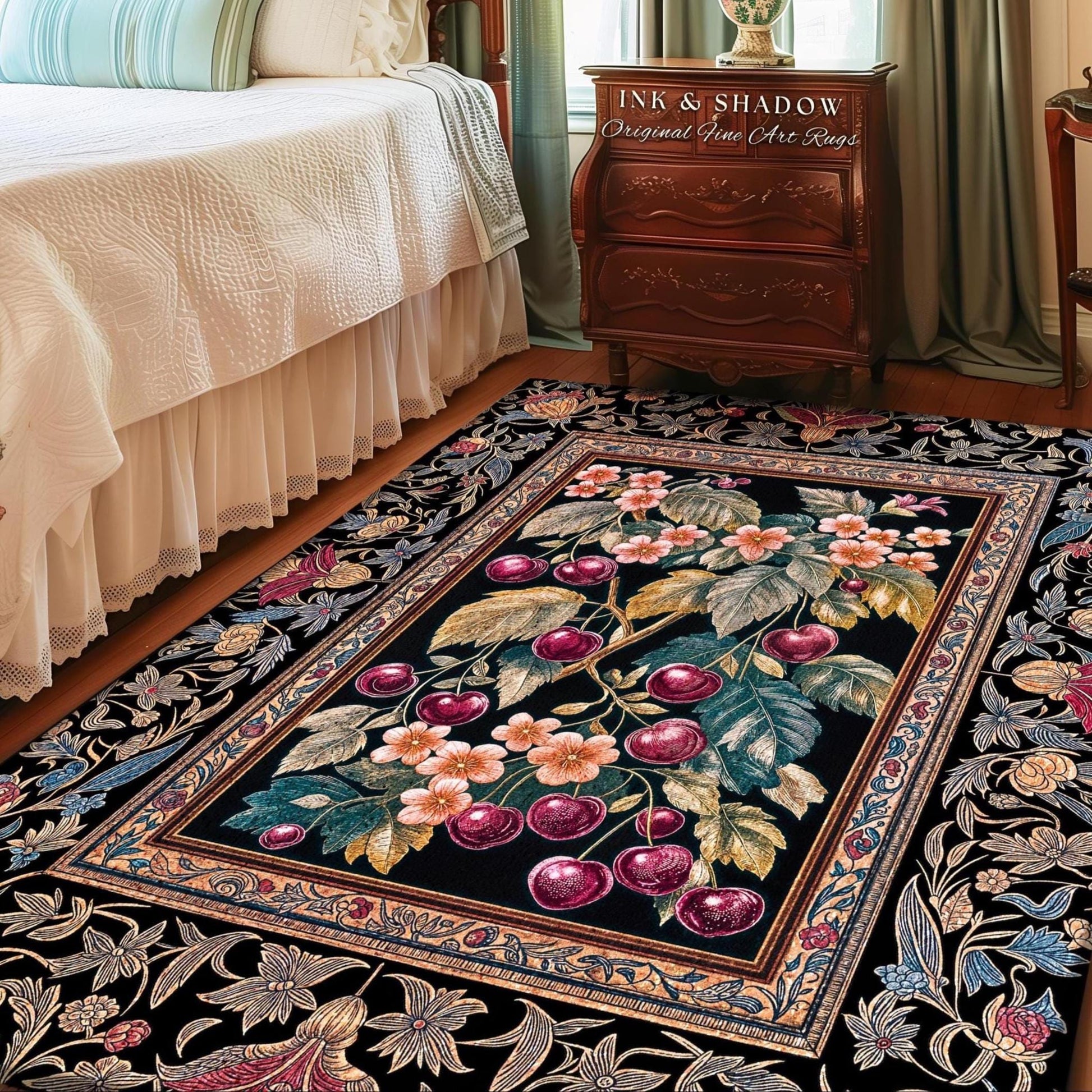 May include: A rectangular area rug with a black background and a floral and cherry design. The central image features a cherry branch with red cherries and pink flowers. The rug has a decorative border with floral patterns and the text "INK & SHADOW Original Fine Art Rugs".