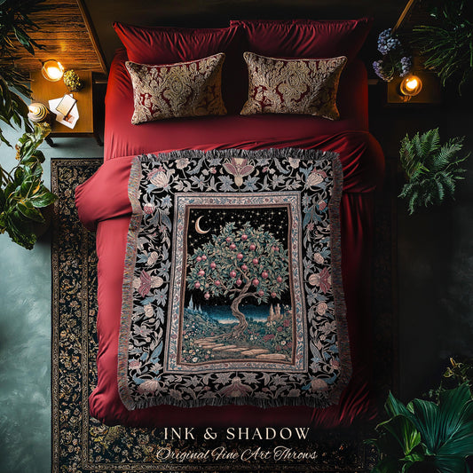 May include: A decorative throw blanket with a detailed tree and night sky design, featuring a crescent moon and stars. The blanket is framed by a floral border and fringed edges. The text "INK & SHADOW Original Fine Art Throws" is at the bottom. The blanket is on a red bed.