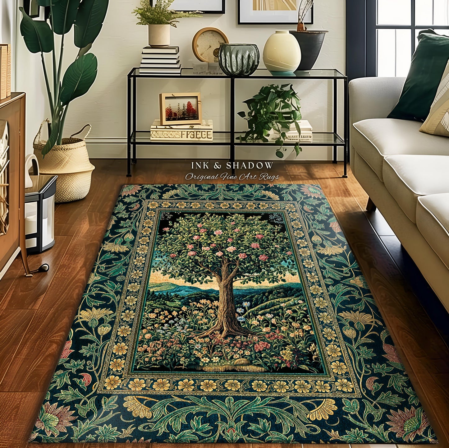 May include: A rectangular area rug with a central tree design, surrounded by floral and foliage patterns. The rug features a dark teal background with accents of green, gold, and pink. The text "INK & SHADOW Original Fine Art Rugs" is visible.