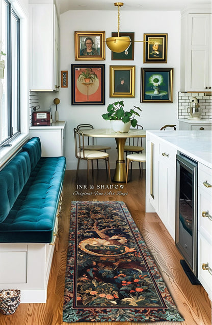 May include: A long, rectangular rug with a detailed, colorful design featuring a dragon, trees, and flowers. The rug is placed in a kitchen with a teal bench, artwork, and a round table. The text "INK & SHADOW Original Fine Art Rugs" is visible.