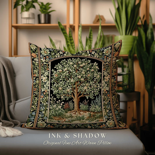 May include: A decorative pillow with a woven tapestry design featuring a stylized tree with green leaves and white flowers. The pillow has a black background with a gold border and the text "INK & SHADOW Original Fine Art Woven Pillow".