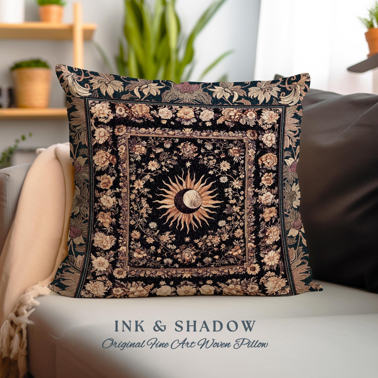 May include: A black and gold woven pillow with a sun and moon design surrounded by floral patterns. The pillow has the text "INK & SHADOW Original Fine Art Woven Pillow" printed on the bottom.