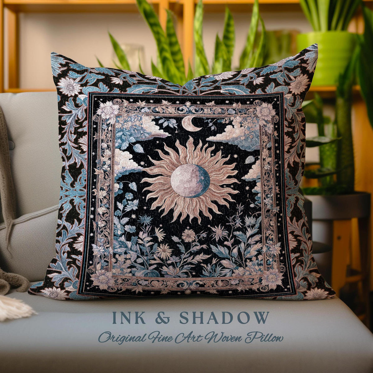 May include: A decorative pillow with a woven tapestry design featuring a sun and moon surrounded by floral motifs. The pillow is black with blue and pink accents and has the text "INK & SHADOW Original Fine Art Woven Pillow" printed on the bottom.