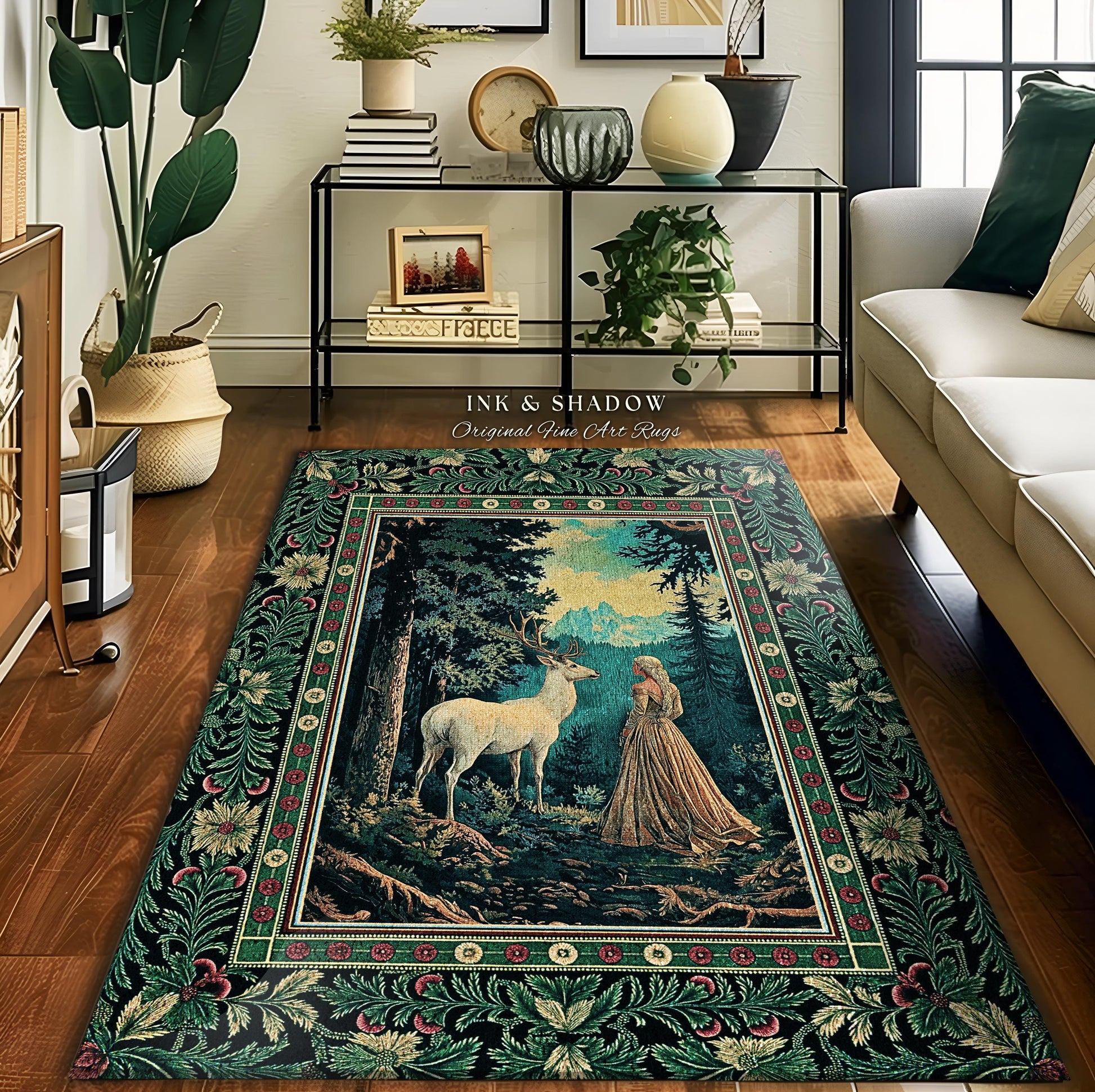May include: A green tapestry rug with a floral border and a central image of a white deer and a woman in a forest setting. The rug features the text "Ink & Shadow Original Fine Art Rugs".