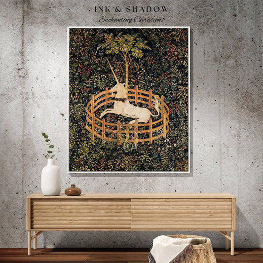 May include: A framed tapestry featuring a unicorn within a wooden fence, surrounded by lush foliage. The artwork has a medieval aesthetic, with a color palette of greens, browns, and creams. The text "INK & SHADOW Enchanting Curations" is at the top.