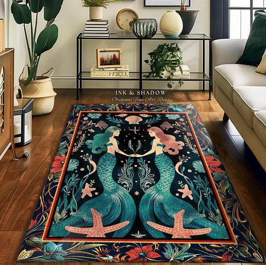 May include: A rectangular area rug featuring a mermaid design. Two mermaids with teal and pink hair are holding hands. The rug has a dark blue background with floral and seashell accents, and the text "INK & SHADOW Original Fine Art Rugs".