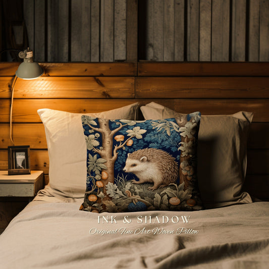 May include: A decorative throw pillow with a woven tapestry design featuring a hedgehog in a forest setting. The pillow has a blue background with green and brown accents. The text "INK & SHADOW Original Fine Art Woven Pillow" is printed on the bottom of the pillow.