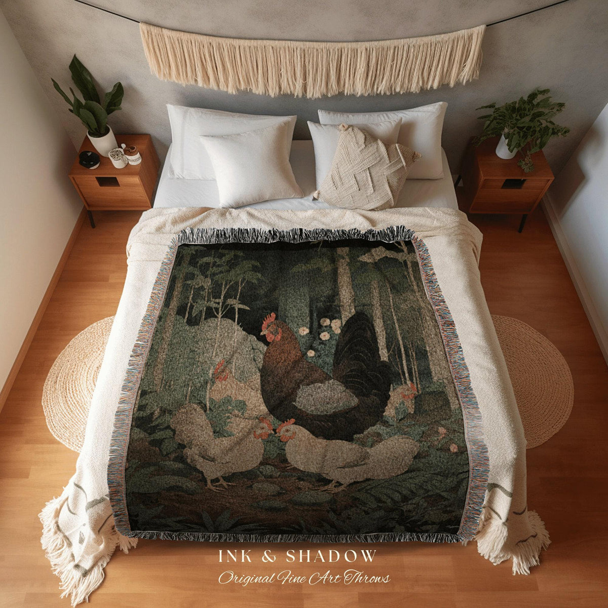 May include: A woven throw blanket featuring a forest scene with a rooster and hens. The blanket has a dark green and brown color palette with fringe edges. The text "INK & SHADOW Original Fine Art Throws" is printed at the bottom.