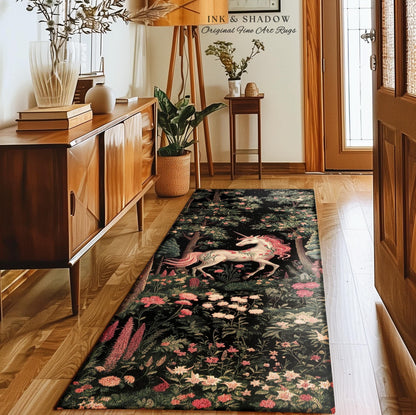 May include: A rectangular runner rug featuring a black background with a detailed print of a white unicorn, pink flowers, and green foliage. The rug is positioned on a wooden floor in a hallway, extending from the foreground toward the back wall.