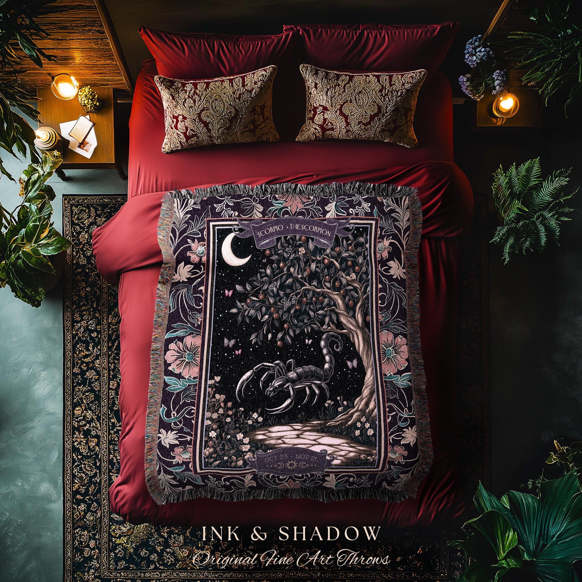May include: A decorative throw blanket with a dark background featuring a scorpion, tree, and moon design. The blanket is draped over a red bed with matching pillows. The text "INK & SHADOW Original Fine Art Throws" is at the bottom.