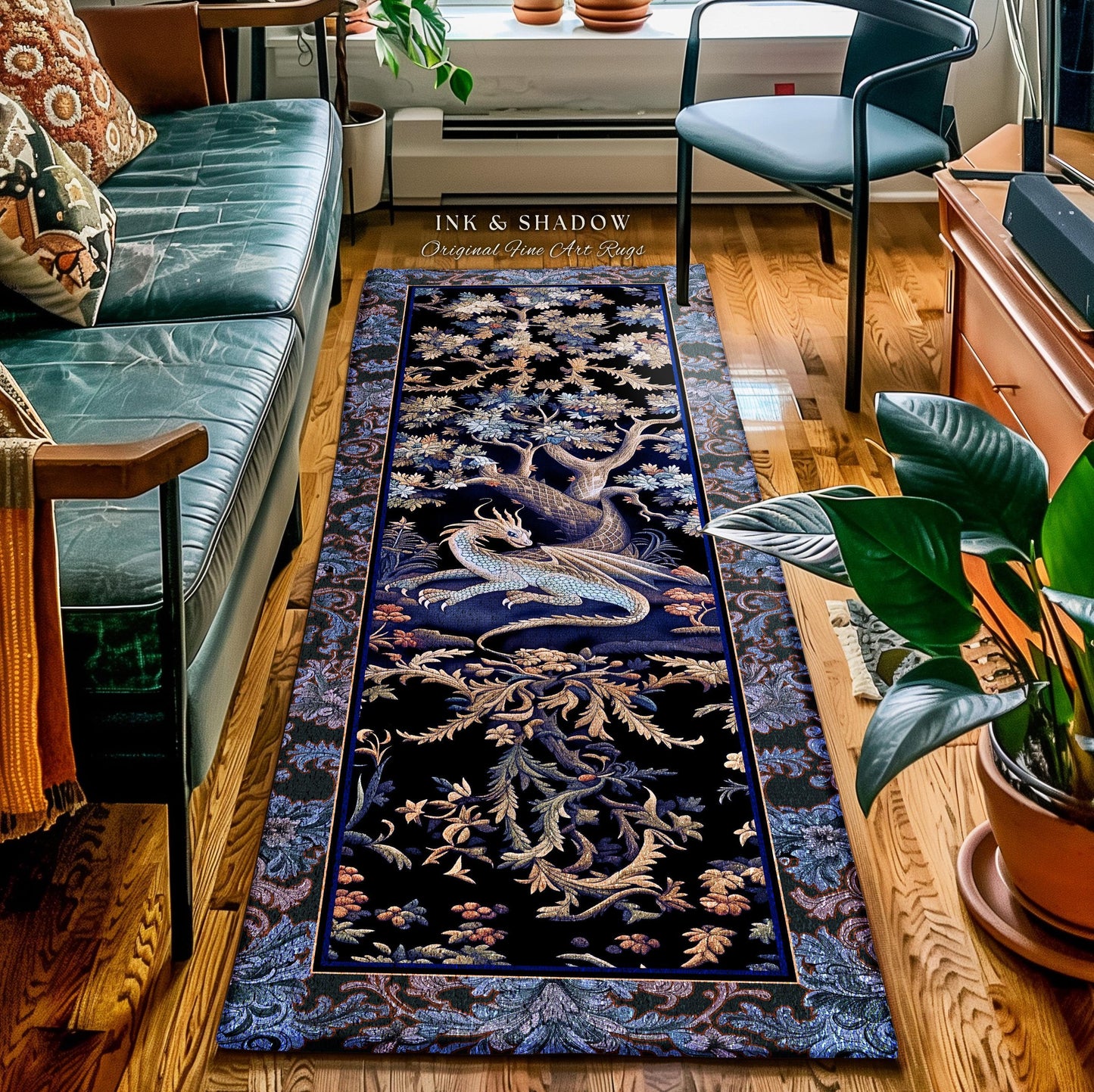 May include: A rectangular black rug with a detailed design featuring a dragon, tree, and floral elements. The rug has a dark blue border and the text "INK & SHADOW Original Fine Art Rugs".