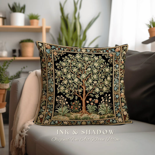 May include: A black and gold woven pillow featuring a detailed tapestry design of a tree with white flowers and green leaves. The pillow has a black background and a gold border. The text "INK & SHADOW Original Fine Art Woven Pillow" is printed below the pillow.