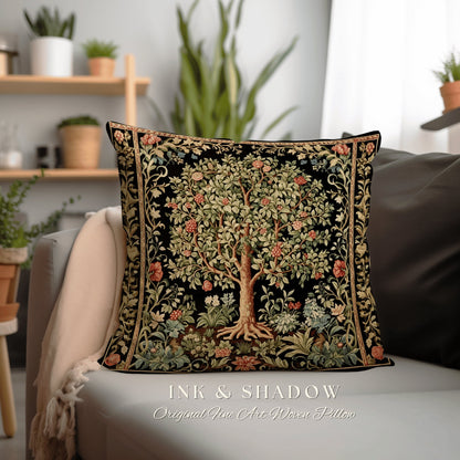 May include: A black pillow with a woven tapestry design of a tree with green leaves and pink flowers. The pillow has a gold border and the text "INK & SHADOW Original Fine Art Woven Pillow" is printed below it.