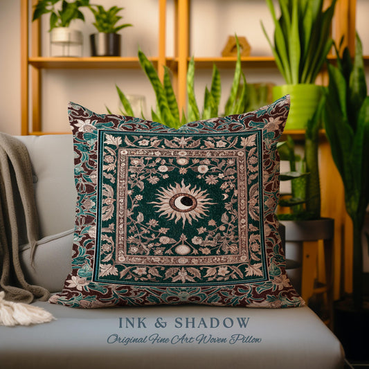 May include: A decorative pillow with a woven tapestry design featuring a sun and moon motif in a green, brown, and cream color scheme. The pillow has the text "INK & SHADOW Original Fine Art Woven Pillow" printed on the bottom.