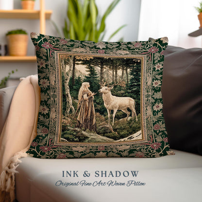 May include: A green throw pillow with a woven tapestry design featuring a woman in a forest with a white deer. The pillow has a gold frame and the text "INK & SHADOW Original Fine Art Woven Pillow" is printed on the bottom.