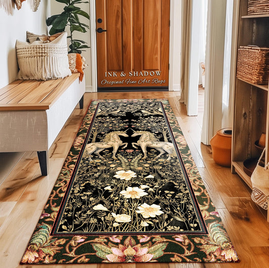 May include: A rectangular black rug with a floral and unicorn design. The rug features a border with a floral pattern in shades of green, pink, and brown. The center of the rug has two white unicorns facing each other. The text "INK & SHADOW Original Fine Art Rugs" is visible.