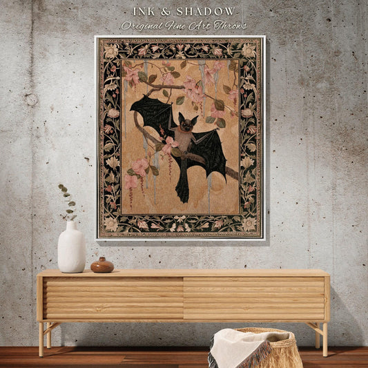 May include: A framed tapestry featuring a bat perched on a flowering branch. The artwork has a beige background with pink flowers and a decorative border. The text "INK & SHADOW Original Fine Art Throws" is at the top.