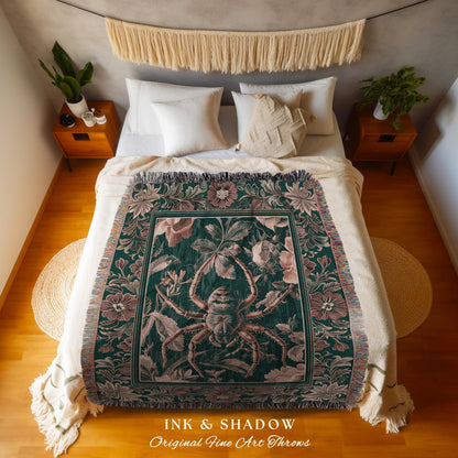 May include: A dark green throw blanket with a large spider and floral design. The blanket has a fringe border and is displayed on a bed with white bedding. The text "INK & SHADOW Original Fine Art Throws" is at the bottom.