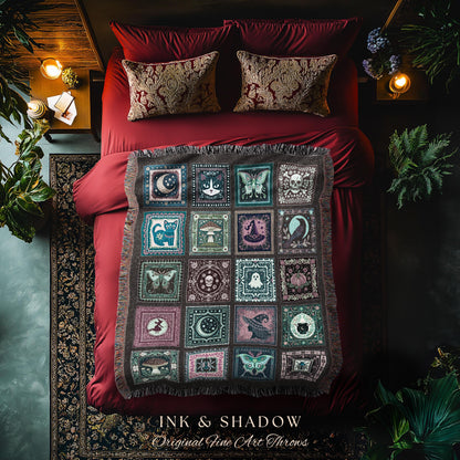 May include: A decorative throw blanket with a patchwork design featuring various mystical and gothic-themed squares. The squares include images of moons, butterflies, skulls, cats, mushrooms, and witches. The blanket is displayed on a red bed with matching pillows. The text "INK & SHADOW Original Fine Art Throws" is at the bottom.
