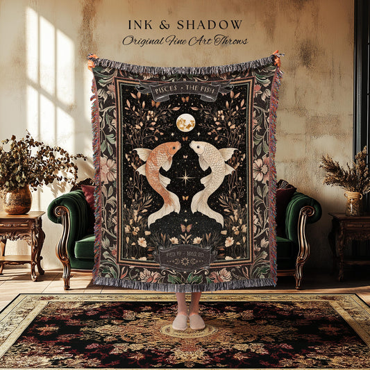 May include: A black throw blanket with a Pisces design featuring two koi fish, a full moon, and floral accents. The blanket has a fringed edge and the text "INK & SHADOW Original Fine Art Throws".