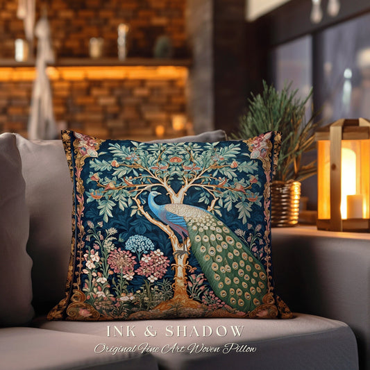 May include: A decorative throw pillow with a woven tapestry design featuring a peacock standing in a tree with flowers and leaves. The pillow is blue, green, and gold with the text "INK & SHADOW Original Fine Art Woven Pillow" at the bottom.