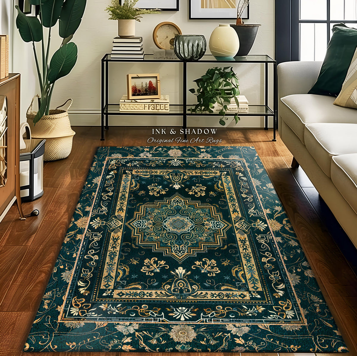 May include: A rectangular, dark teal rug with an ornate, floral design. The rug features a central medallion and a border with gold and cream accents. The text "INK & SHADOW Original Fine Art Rugs" is visible on the rug.